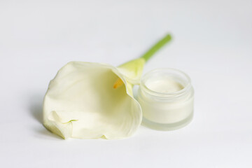 Cream in a jar on a white background