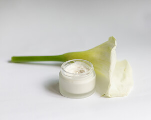 Cream in a jar on a white background