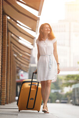 Girl traveler and suitcase