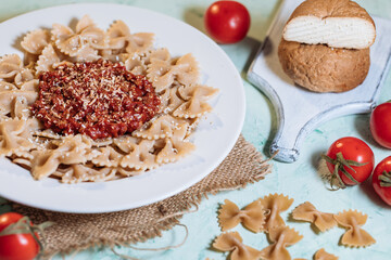 Pasta with bolognese sauce and grated cheese