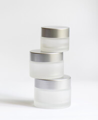 jar of cream on a white background