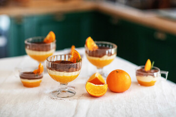 Homemade tiramisu with tangerines on a table