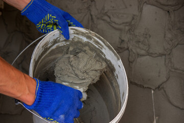 man plastering the wall. Construction, repairs in the house.