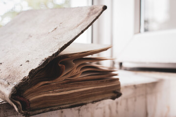 Old weathered book with empty pages. Education concept. History concept. Aged open book. Wisdom and knowledge concept. Vintage hardcover of book. School background. Retro literature. The past concept.