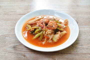 boiled mixed vegetable topping shrimp Thai spicy soup on plate