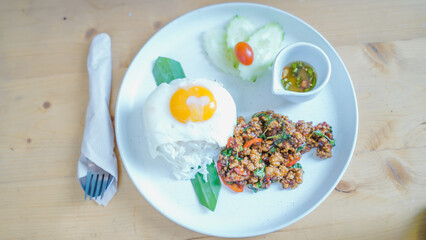 Rice topped with stir fried pork and basil.