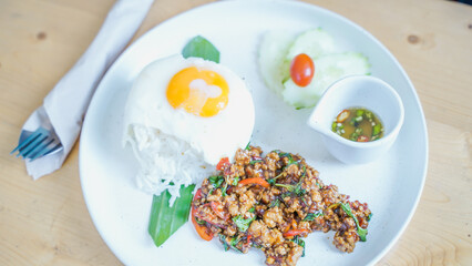 Rice topped with stir fried pork and basil.