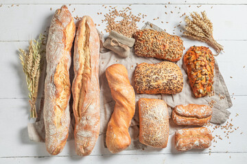 Crunchy baguettes and buns baked in bakery. Made of wheat.