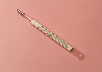Clinical Thermometer put on pastel background