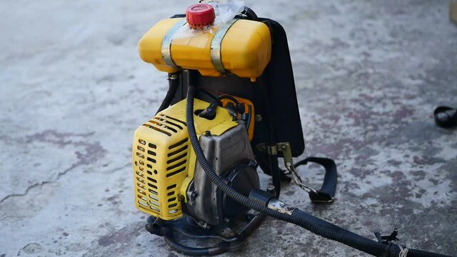 Noise-sounding gasoline-fueled lawn mower with 2T . engine