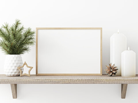 Horizontal wooden frame mockup with pine branch in vase, pinecone, star and candles on rustic rough shelf on white wall background. Minimal Christmas interior decoration. 3d rendering, illustration