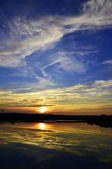 Sunset near the pond in the village