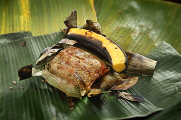 roasted fish, an indigenous Brazilian dish baked in a banana leaf