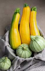 Long yellow zucchini and green round zucchini