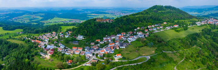 Fototapeta na wymiar Aerial view of the village Rechberg and castle Burg Hohenrechberg in Germany, Bavaria on a sunny day in Spring