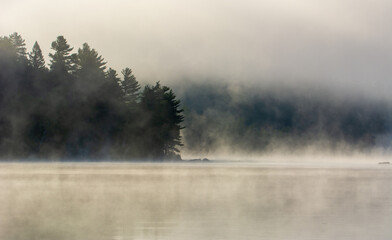 Mist on a great lake in Quebec, Canada in the morning