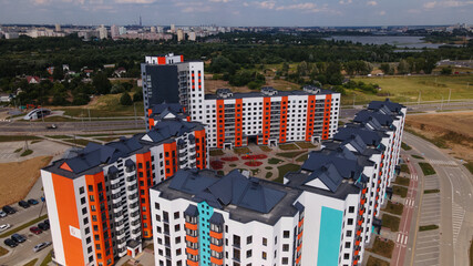 Construction site for a new city block. New houses have been built. Aerial photography.