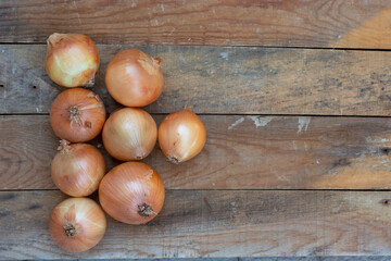 big tasty onions on wooden table