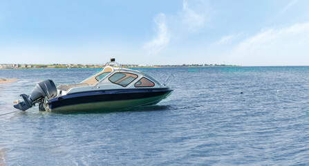 sea motor boat parked in the lagoon near coastline, travel summer vacation