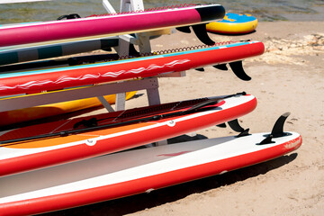 sup surf board rack shelf on the sea coastline vacation concept