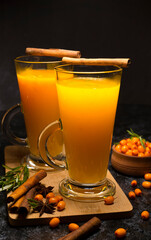Two cups of hot sea buckthorn tea with spices