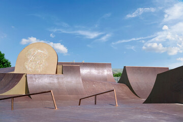 empty skatepark in the city public park. freestyle extreme sports spot - obrazy, fototapety, plakaty