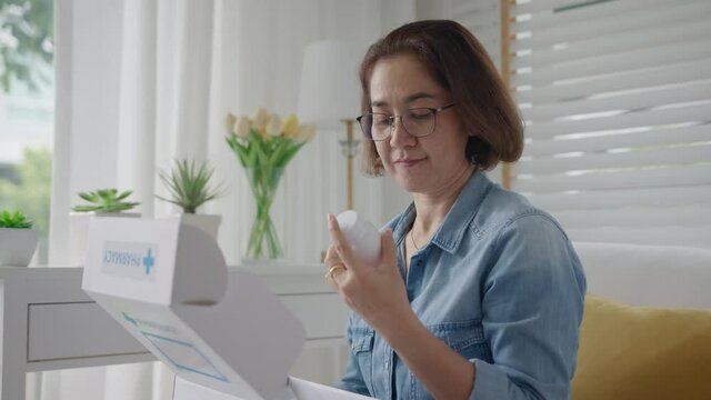Asia people or latin lady sit at home sofa couch buy herbal self cure Rx pill or covid free first aid kit postal box hospital clinic post mail in health care help service in telehealth telemedicine.