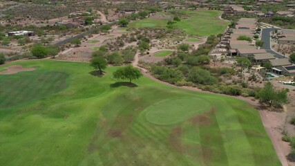 A high definition aerial view of a desert golf course located in the American southwest.