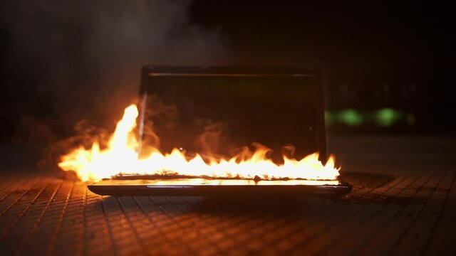 Laptop keyboard on fire and melting