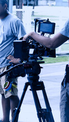Video production behind the scenes. Making of TV commercial movie that film crew team lightman and...