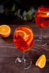 Aperol Spritz Italian cocktail alcoholic beverage with ice cubes and oranges.