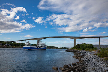 Naklejka premium General cargo ships under the Brønnøysund bridge,Helgeland,Nordland county,scandinavia,Europe