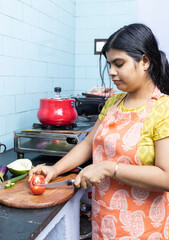 Indian housewife in kitchen