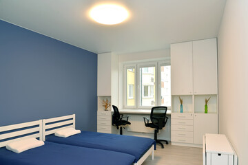 Fragment of bedroom interior with white furniture