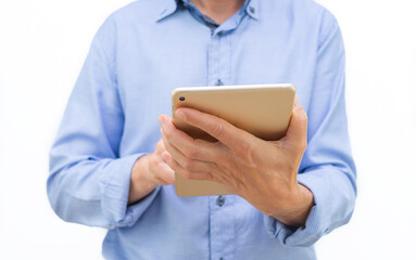 Man with tablet in hands and blue shirt on white background. Copy space.