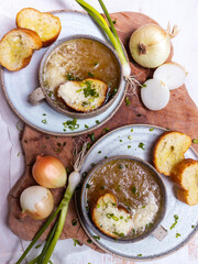 French cuisine onion soup in a ceramic cup with croutons