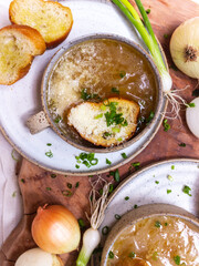 French cuisine onion soup in a ceramic cup with croutons