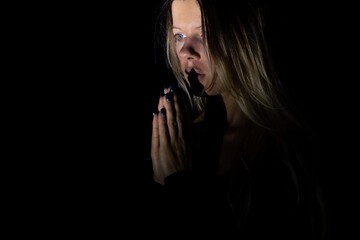 young girl praying to god in the dark, young girl in the dark, religion and people