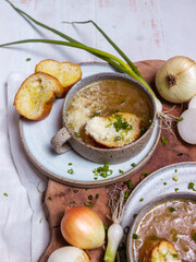 French cuisine onion soup in a ceramic cup with croutons