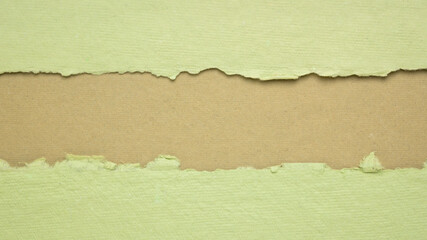 paper abstract in green and beige with a copy space - sheets of handmade paper, blank web banner
