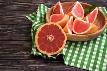 fresh grapefruit slices on concrete background
