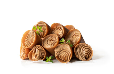 mini cone cake with whipped cream and toffee isolated on white