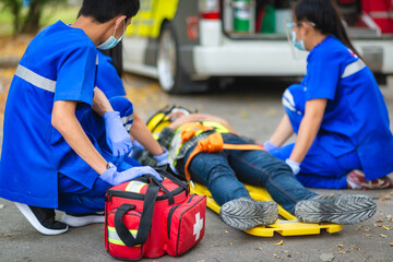 Emergency accident patient Suffered on head lying on stretcher. First aid training and move patient...