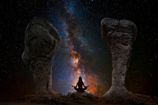 Woman meditating with yoga between dolmens