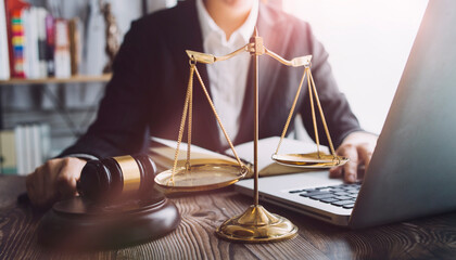 Business and lawyers discussing contract papers with brass scale on desk in office. Law, legal...
