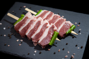 fresh raw meat presentation on granite