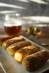 
Typical croquettes of Spanish cuisine. Traditional tapas of Spanish cuisine. Vegan tofu, sweet potato and mushroom croquettes.