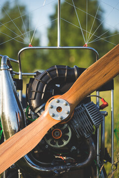 A closeup of a paramotor with a wooden propeller for individual paralet flights. Extreme sports. Selective focus