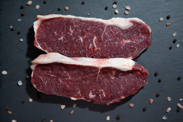 fresh raw meat presentation on granite