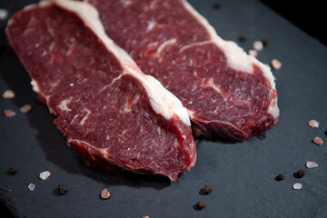 fresh raw meat presentation on granite